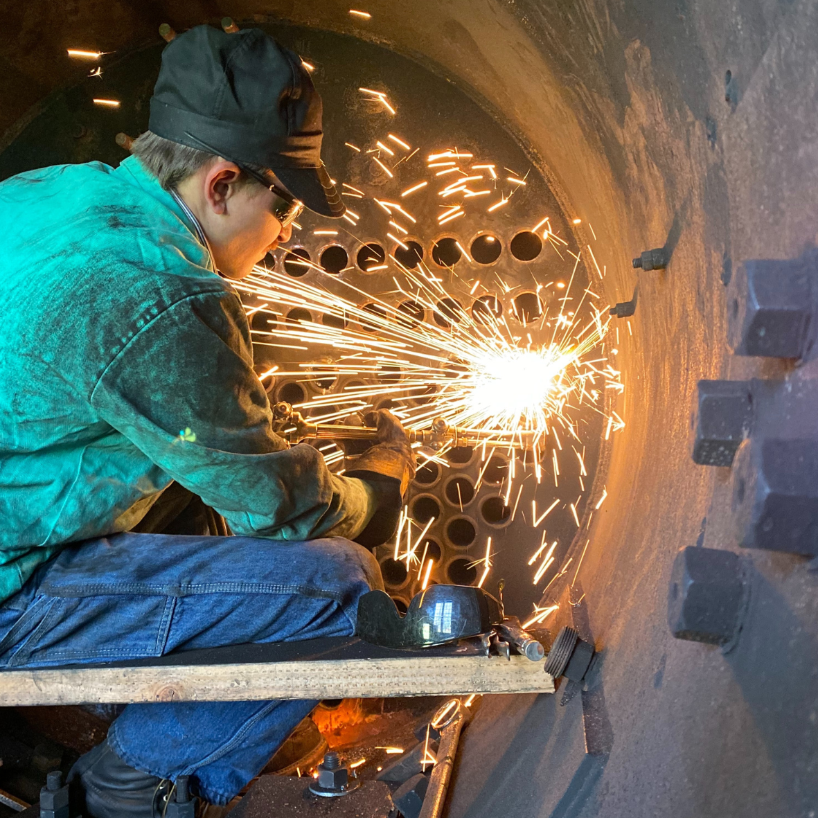 Person working with sparks flying